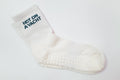 White grip sock with 'Hot on Yacht' text on a white background